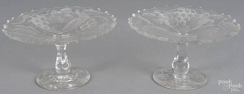 Pair of Tuthill brilliant cut glass tazza with vine and berry motif, unsigned, 4 1/2'' x 8''.