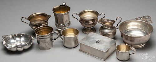 Ten pieces of sterling silver, to include children's mugs, a porringer, etc., 41 ozt.