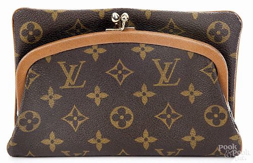 Louis Vuitton monogrammed clutch, 10 1/4'' h., 7 1/2'' w.