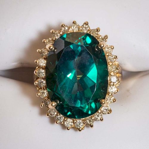 Dark Green Oval Topaz and Diamond 14 KT Gold Ring