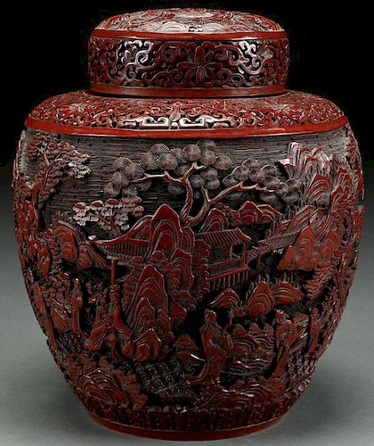 A CHINESE QING DYNASTY CARVED CINNABAR COVERED