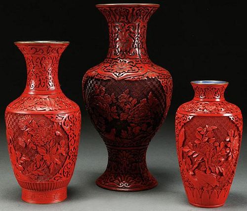 A GROUP OF THREE CHINESE CARVED CINNABAR RED