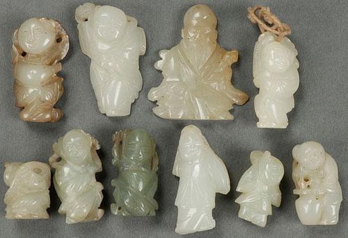A GROUP OF TEN CHINESE CARVED JADE FIGURES