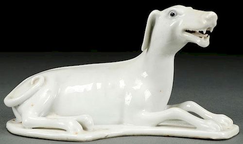 A CHINESE EXPORT WHITE GLAZED FIGURE OF A DOG