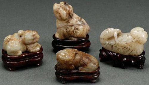 A GROUP OF FOUR CHINESE CARVED JADE FIGURAL