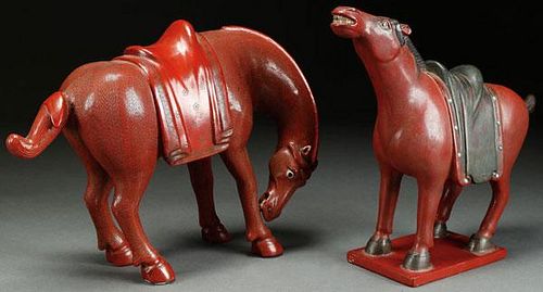 A PAIR OF CHINESE CARVED RED LACQUER FIGURAL