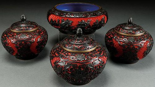 A FOUR PIECE GROUP OF CHINESE CARVED CINNABAR