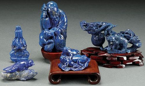 A GROUP OF FIVE CHINESE CARVED BLUE LAPIS FIGURES