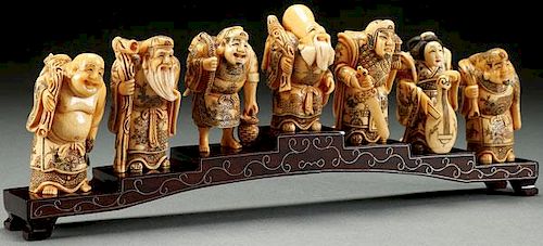 A SET OF SEVEN CHINESE CARVED BONE LUCK GODS