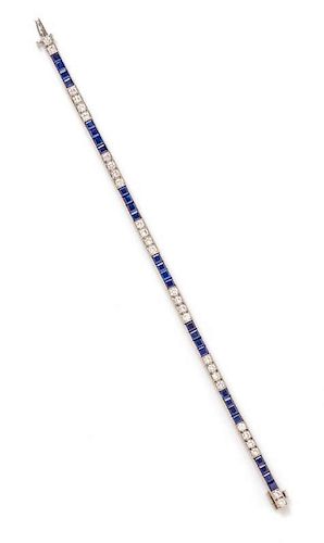 A Platinum, Diamond and Sapphire Line Bracelet, 16.70 dwts.