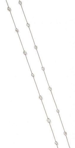 An 18 Karat White Gold and Diamond Station Necklace, 3.60 dwts.