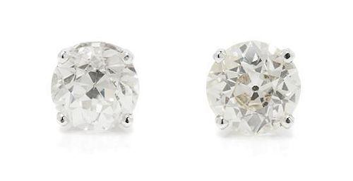 A Pair of White Gold and Diamond Stud Earrings, 1.20 dwts.