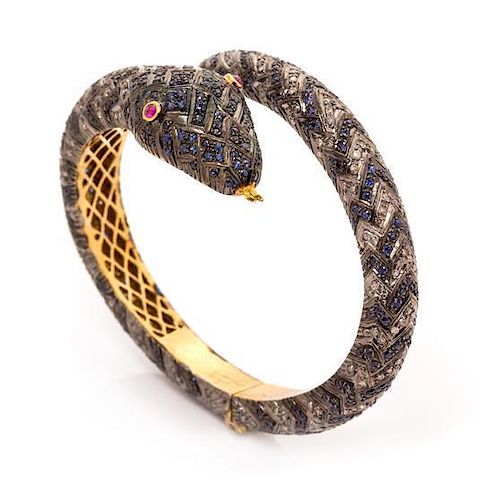 A Gilt Silver, Ruby, Sapphire and Diamond Snake Motif Bypass Bangle Bracelet, 60.20 dwts.