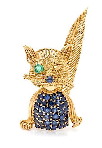 * An 18 Karat Yellow Gold, Sapphire and Emerald Cat Brooch, Circa 1960, 12.20 dwts.