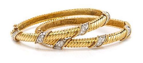 * A Pair of 18 Karat Yellow Gold and Diamond Bangle Bracelets, 26.00 dwts.