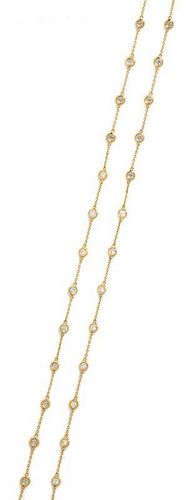 A 14 Karat Yellow Gold and Diamond Station Necklace, 5.70 dwts.