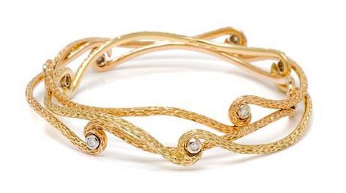 A Collection of 18 Karat Gold and Diamond Bangle Bracelets, Roberto Coin, 27.60 dwts.