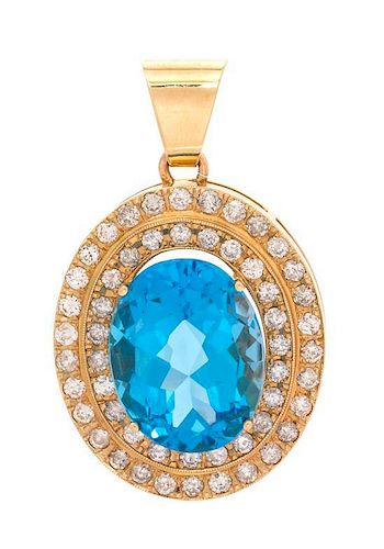 A Yellow Gold, Blue Topaz and Diamond Pendant, 12.90 dwts.