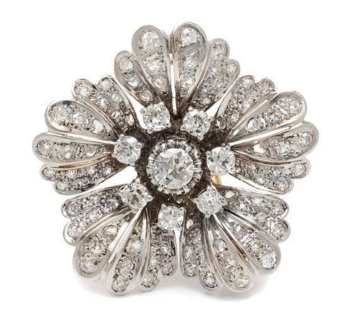 A Platinum Topped Gold and Diamond Floral Motif Brooch, 12.50 dwts.