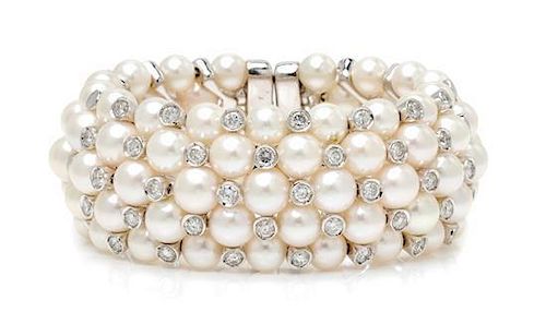 An 18 Karat White Gold, Diamond, and Cultured Pearl Cuff Bracelet, 68.90 dwts.