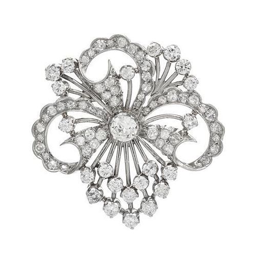 A Platinum and Diamond Floral Motif Brooch, 7.80 dwts.