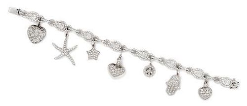 An 18 White Gold and Diamond Bracelet with Seven Attached Charms, 21.40 dwts.