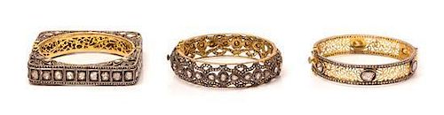 A Collection of Gilt Silver and Diamond Bangle Bracelets, Indian, 71.70 dwts.