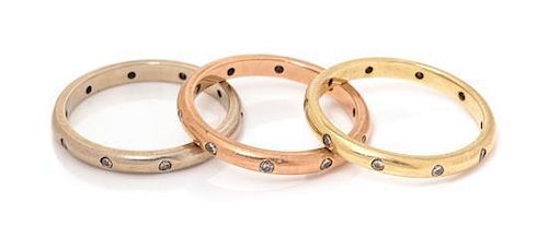 A Collection of 14 Karat Gold and Diamond Stacking Eternity Bands, 4.70 dwts.