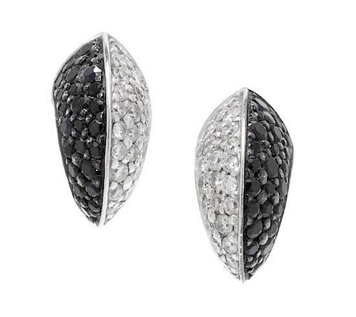 A Pair of 18 Karat White Gold, Diamond and Black Diamond Stud Earrings, Stephen Webster, 4.00 dwts.