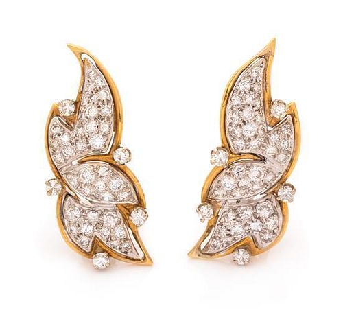 A Pair of Bicolor Gold and Diamond Earclips, 6.60 dwts.