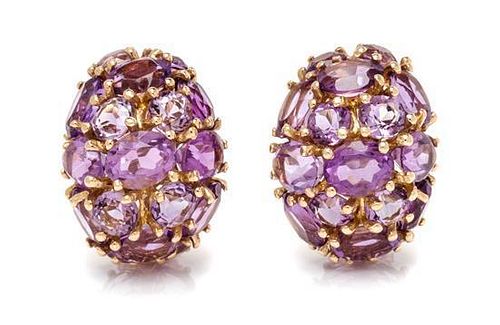 A Pair of 14 Karat Yellow Gold and Amethyst Earclips, 13.40 dwts.
