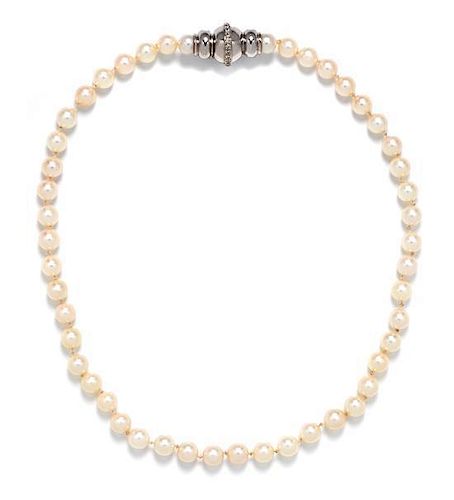 A 14 Karat White Gold, Diamond and Cultured Pearl Necklace, 33.50 dwts.
