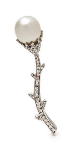 * An 18 Karat White Gold, Diamond and Cultured South Sea Pearl Flower Motif Brooch, RCM, 11.10 dwts.