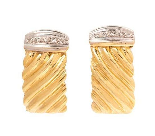 A Pair of Bicolor Gold and Diamond Earclips, 11.90 dwts.