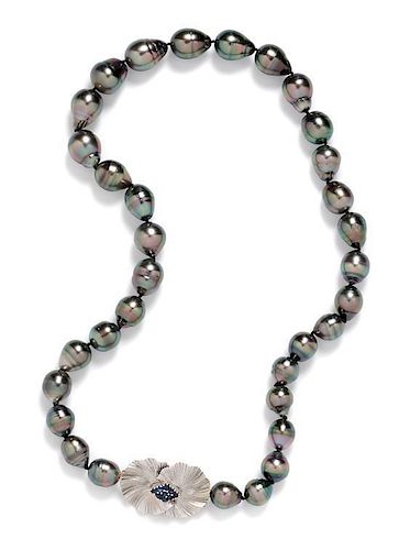 * A White Gold, Sapphire and Graduated Cultured Tahitian Pearl Necklace, 60.00 dwts.