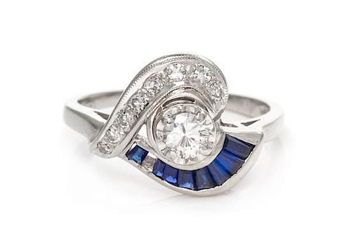 A 14 Karat White Gold, Diamond and Sapphire Ring, 3.00 dwts.