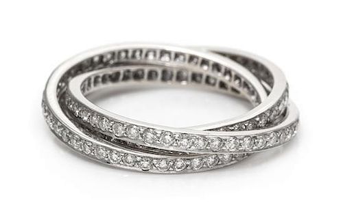 A White Gold and Diamond Triple Rolling Ring, 4.40 dwts.