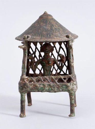 INDIAN METAL FIGURE SEATED UNDER A CANOPY, BASTAR