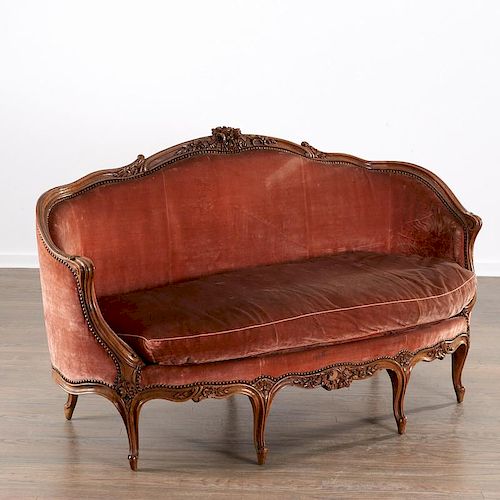 Louis XV carved walnut canape