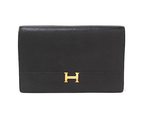 An Hermes Black Lizardskin Leather Clutch, 9 1/2 x 6 1/2 x 3 inches.