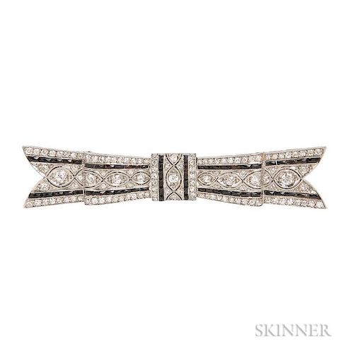 Art Deco Platinum, Diamond, and Onyx Brooch, designed as a bow bead-set with old European- and single-cut diamonds and French