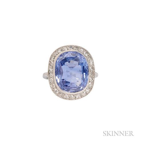 Platinum, Sapphire, and Diamond Ring, bezel-set with a cushion-cut sapphire measuring approx. 12.50 x 10.00 x 6.00 mm, framed