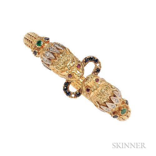 18kt Gold Gem-set Bracelet, Lalaounis, designed as lion's heads grasping a ring, woven gold band, 53.0 dwt, signed, lg. 6 3/4
