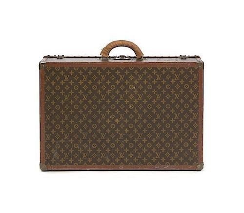 A Louis Vuitton Monogram Hardsided Suitcase, 27 1/2 x 18 x 8 inches.