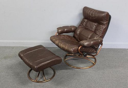 Vintage Leather Upholstered Chair and Ottoman.