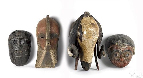 Four African carved and painted masks