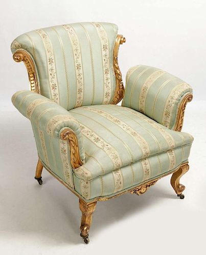 A FRENCH STYLE CARVED AND GILDED WOOD CHAIR W/SILK