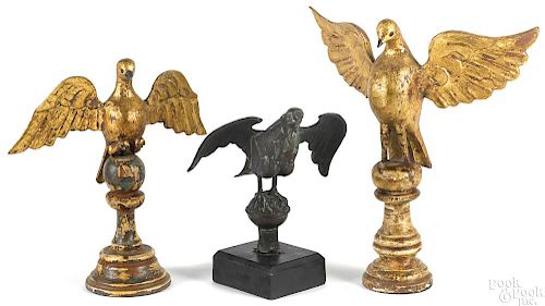 Two carved and gilt decorated eagles