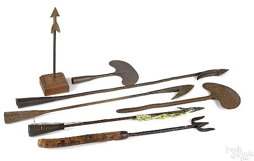 Collection of iron harpoons and whaling tools
