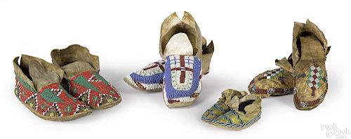 Four prs of Native American beaded hide moccasins